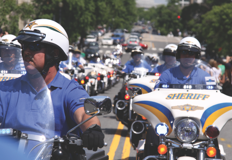 Officers Riding on Motorcycles Officers Riding on Motorcycles